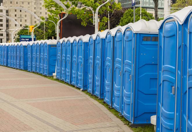 hygienic portable restrooms lined up at a beach party, ensuring guests have access to the necessary facilities while enjoying the sun and sand in Dearborn Heights